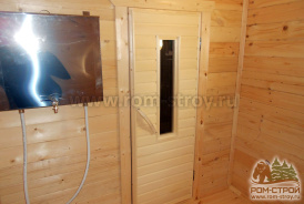 Интерьер брусовой бани 6х6, печь в парной, выносной бак