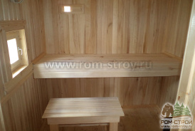 Печь с сеткой и столярные изделия в готовой бане