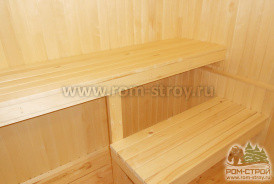 Интерьер брусовой бани 6х6, печь в парной, выносной бак