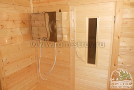 Интерьер брусовой бани 6х6, печь в парной, выносной бак